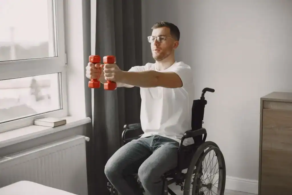 Image of man doing exercise in his wheelchair to aid weight loss Maidstone