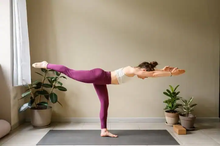 Woman doing Yoga exercise Maidstone to help with toning the body. 