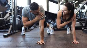 Image of man and woman doing Cardio Maidstone to tone their arms. 